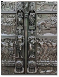 The Doors: These huge bronze doors, which weigh approximately two tons, hold ten panels in bas-relief, five on each side. They depict every step of the process of growing, harvesting, and shipping tea in Ceylon. The panels are flanked by two vertical rows of small figures in high relief. In between the panels are designs of tea leaves and tea berries. 