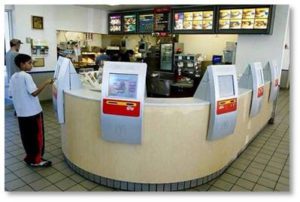 Wendy’s and other fast-food restaurants are reacting to the drive for a $15 minimum wage by replacing human workers with self-order kiosks this year.  Other fast-food restaurants are following suit and next week McDonald’s opens an outlet in Phoenix that is completely staffed by robots, including in the kitchen.