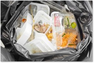 trash, plastic, clamshell containers, discarded food, food waste