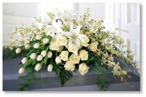 funeral flowers on casket