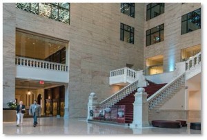 Why does a graceful marble staircase, a symbol of Gilded Age elegance, rise in the atrium of a shiny glass-walled office tower? Where did it come from? And why is it a stairway to nowhere, ending in a blank wall? 