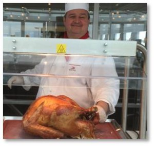 Chef Pascal carves the Thanksgiving bird on Viking Forseti