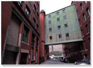 Recently residents of the Fort Point Channel district got together to protect a four-story, 19th-century overhead pedestrian bridge over Necco Court from being demolished. So clearly it had some value—and that was no skyway.