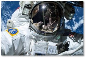 Astronaut spacewalking with earth in background